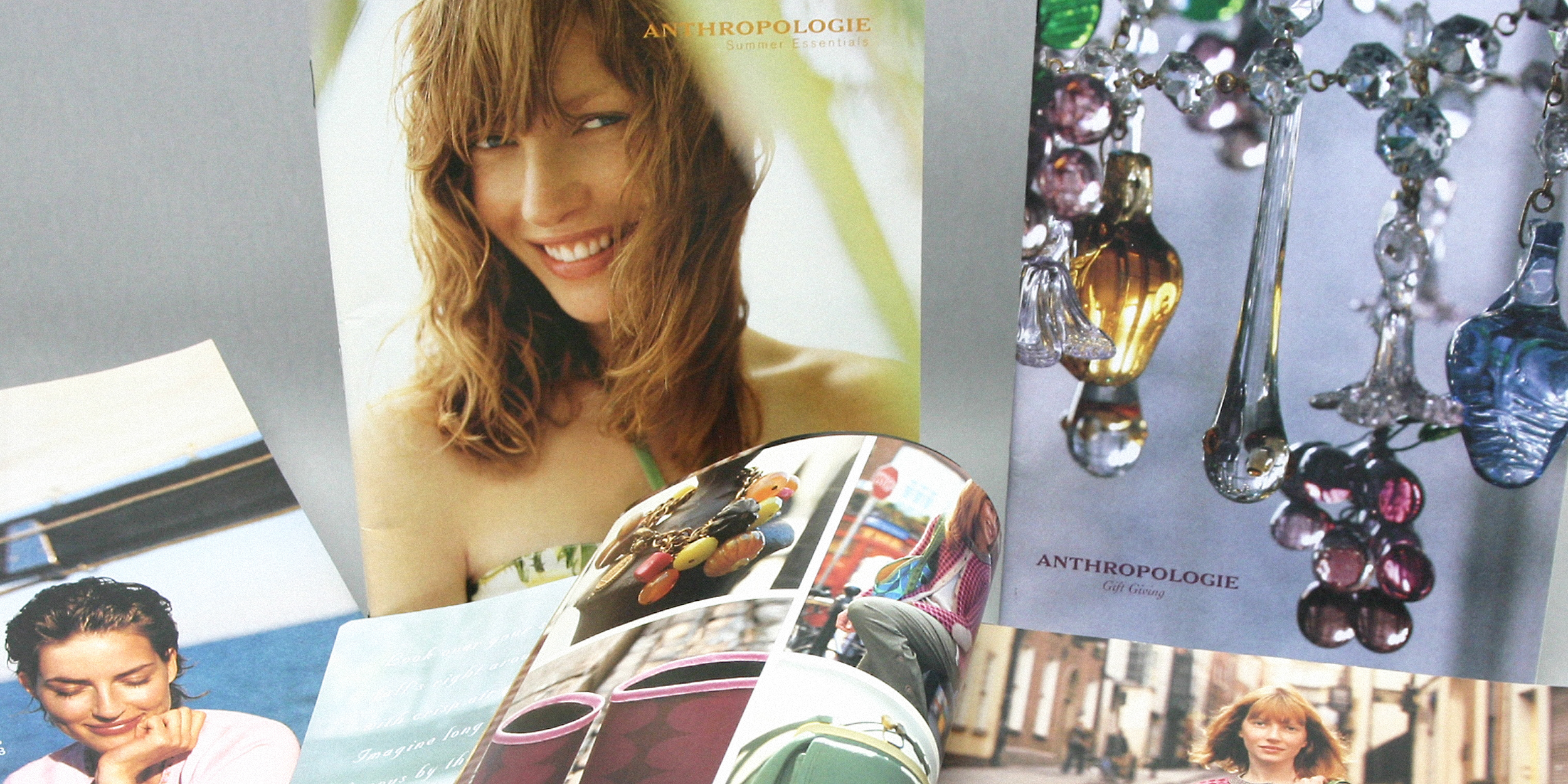 Lifestyle magazine spread featuring fashion and interior design photos in neutral tones.