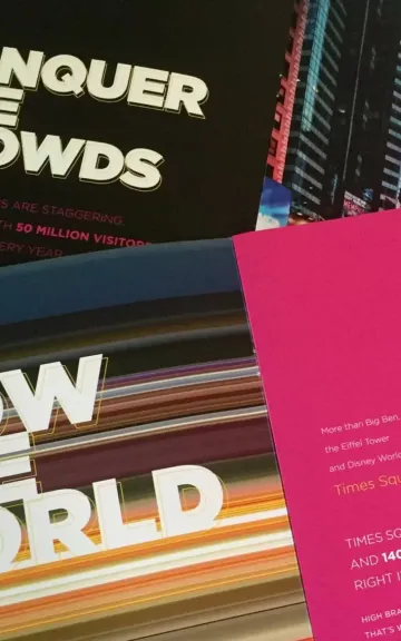 Books with titles "CONQUER THE CROWDS" and "OW THE WORLD" with pink and black color scheme.