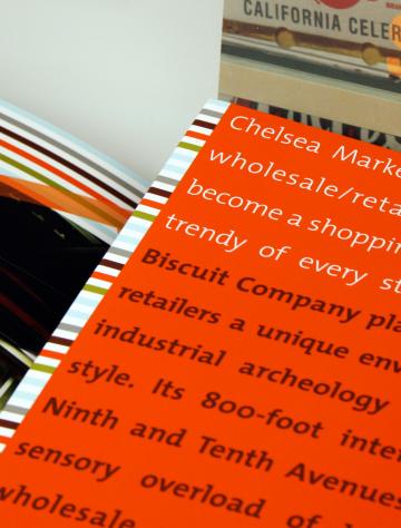 Colorful spiral bound notebooks with orange and striped covers stacked together.