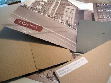 Stack of various mail envelopes and packages, including one marked "Confidential"