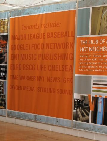 Orange display panel with text about the Hudson's Bay building's history and architecture.