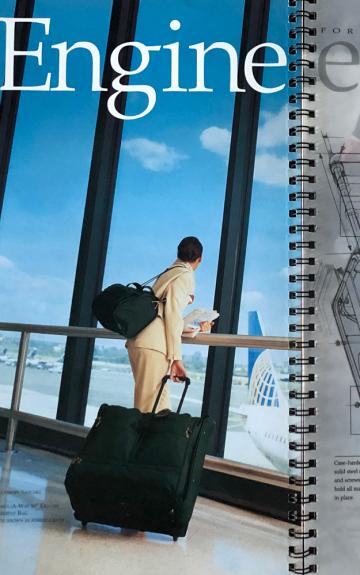 A magazine titled "Engineered" showing a person looking out a window, alongside technical blueprints.