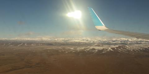 photo of the Andes from an airplane window